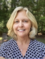 Wendy Scott headshot, wearing a blue shirt with white polka dots