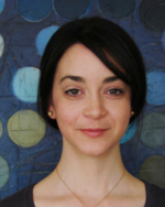 Headshot of Liz Williams wearing a black shirt in an indoor setting.