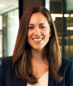 Woman with long brown hair smiling