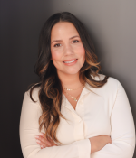 Woman with long brown hair smiling