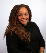 Woman with long brown hair smiling