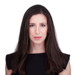 Woman with long brown hair with a black blouse