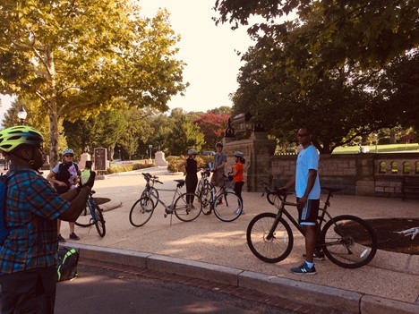 Group of bike riders at the start of the tour route