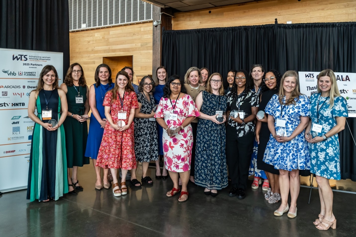 Group photo of WTS NC Triangle mentorship program graduates holding plaques at the Go Gala