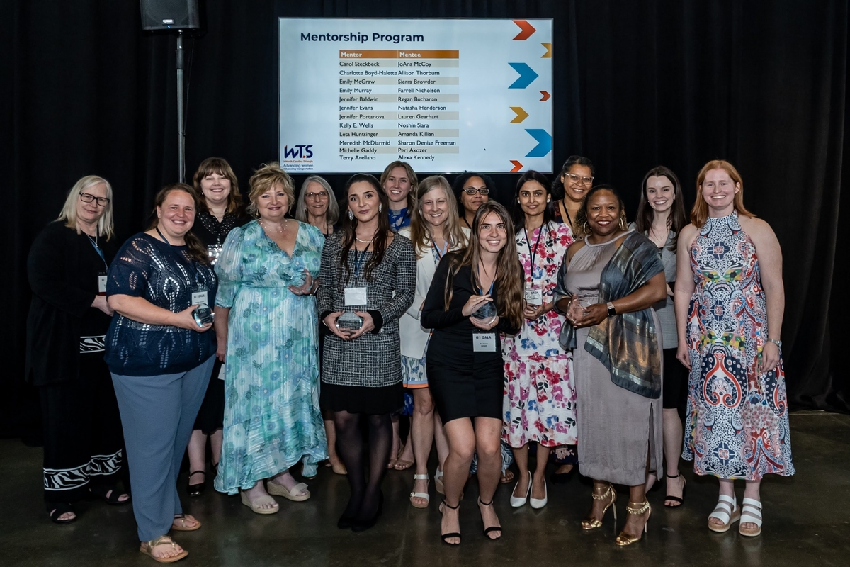 Smiling group of women in cocktail attire honored at the 2026 Go Gala for graduating the mentorship program