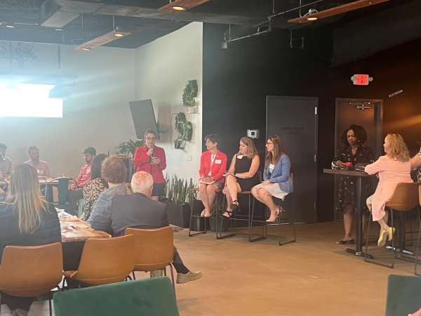 Moderator and three female panelists at the State of Transportation Event.