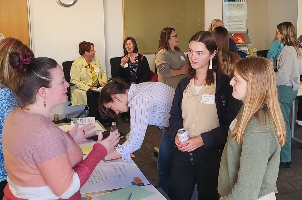 Attendees at the WTS Boston New Member Orientation network 