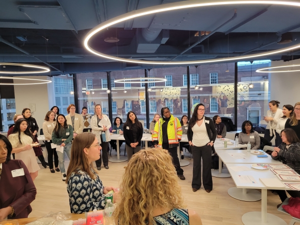New members gather to learn about WTS-Boston, its committees, and how to get involved.