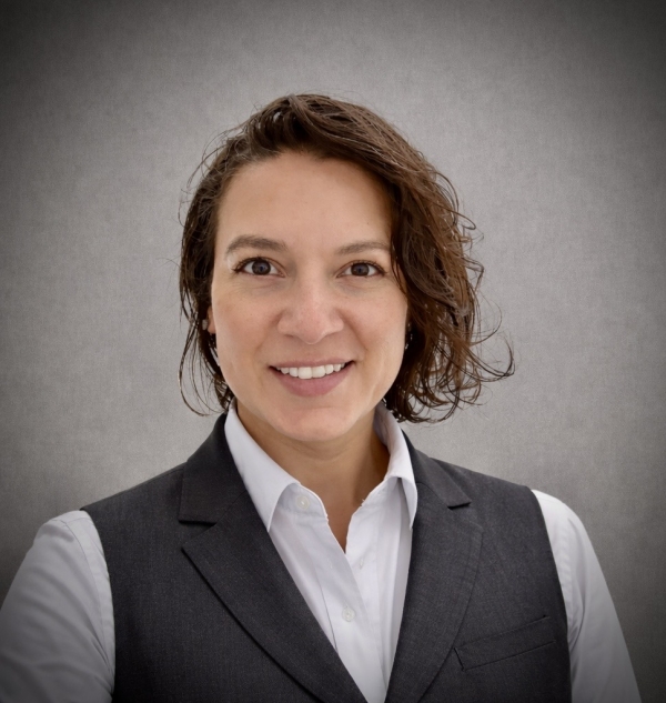 Woman with short brown hair smiling