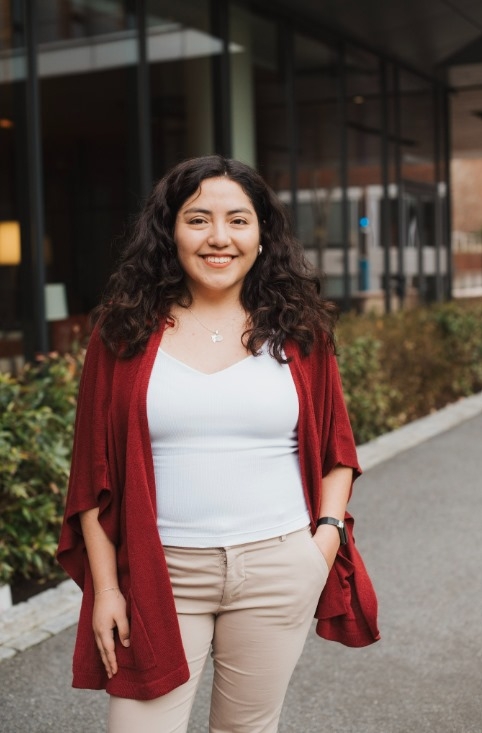 Woman with long brown hair smiling