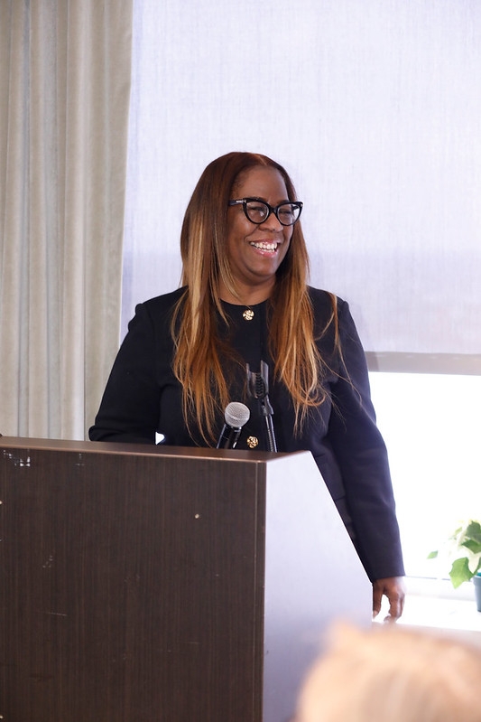 Woman smiling at podium