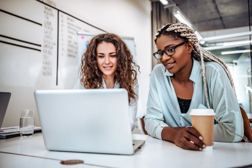 Two women at laptop