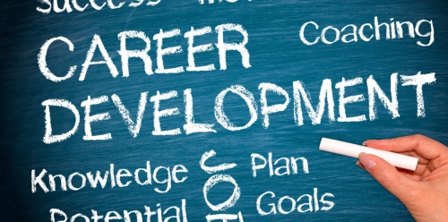 Chalkboard with the words career development, coaching.
