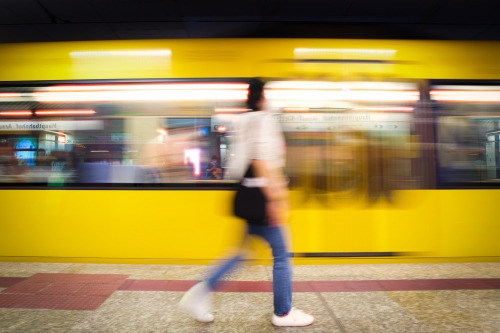 Woman passing train