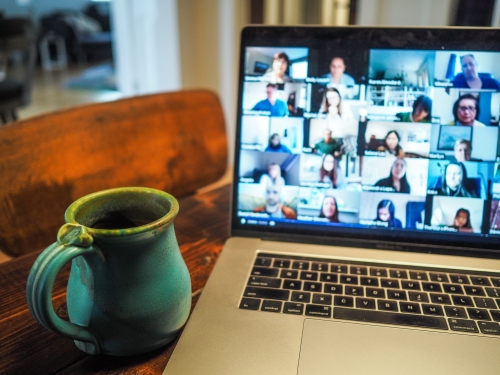 Cup of coffee and laptop on Zoom