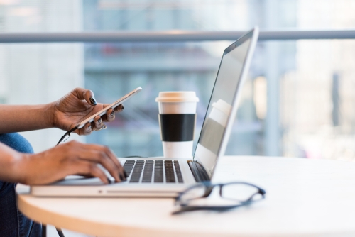 laptop, coffee, and phone