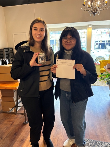 Megan and Jill picking up the check