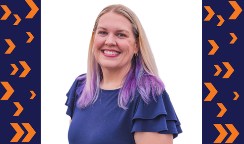 Headshot of WTS Boston President Sarah Bergman flanked by navy blue rectangles with orange arrows