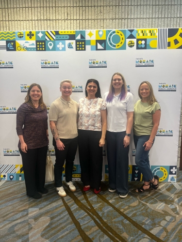 Group photo of WTS-Boston executive board. From left to right: Gina Solman, Katie Kalugin, Selma Mandzo, Sarah Bergman, and Alyssa Resendez Peck.