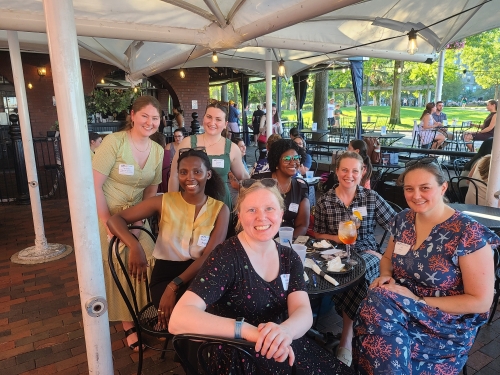 Chapter members socializing outdoors at a restaurant.