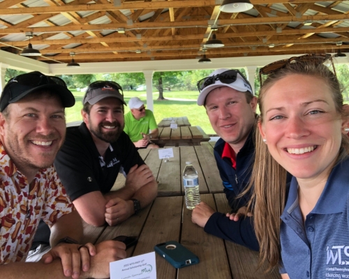 NTM's team enjoying lunch after a hard day on the green.