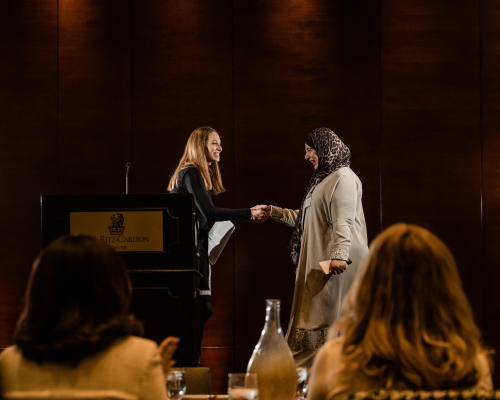 Woman presenting award