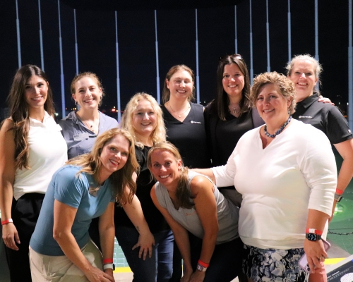 WTS Tucson Board poses at Topgolf