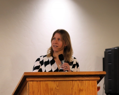 Woman speaking at podium