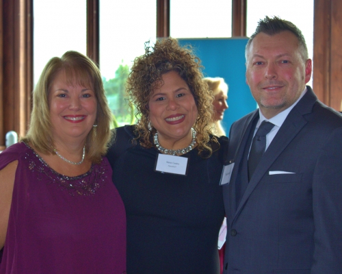 Woman of the Year poses with Director at Large and guest