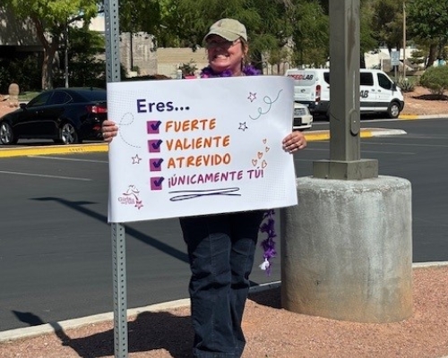 Volunteers with sign of support