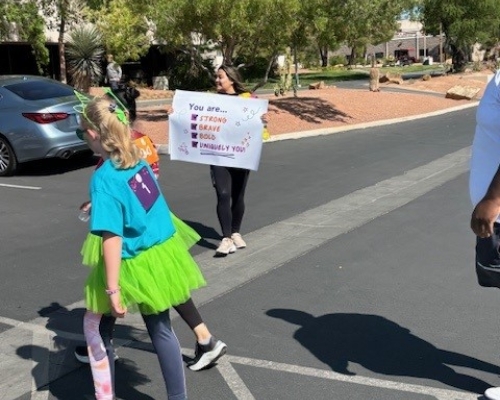 Volunteers with sign of support