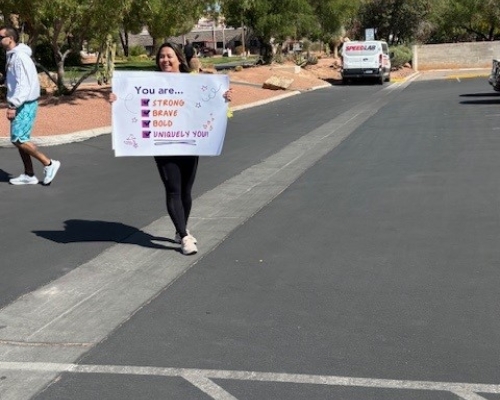 Volunteers with sign of support