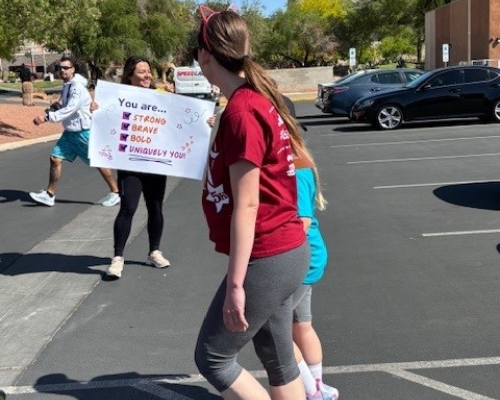 Volunteers with sign of support
