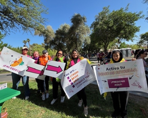 Volunteer group holding signs