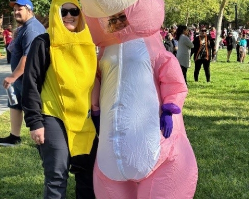 Banana and unicorn costumed supporters