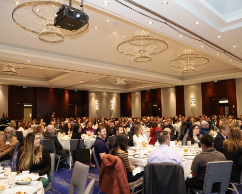 Attendees sitting at tables during the luncheon