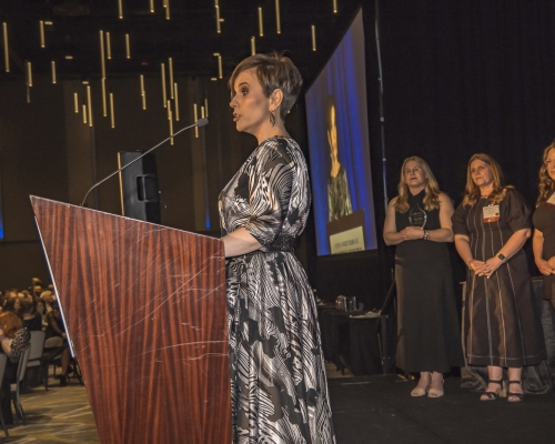 Member of year Masha Podolsky giving acceptance speech