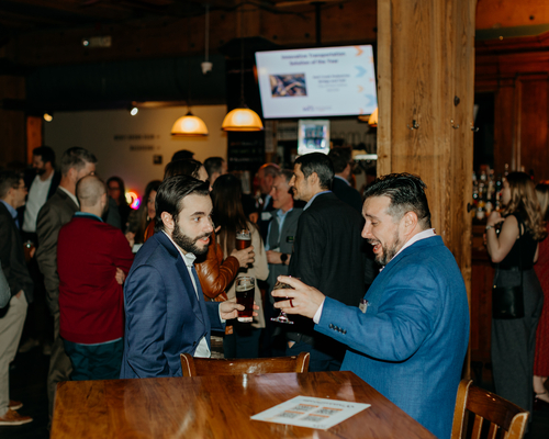 Two people engaging in conversation at the annual awards gala. 