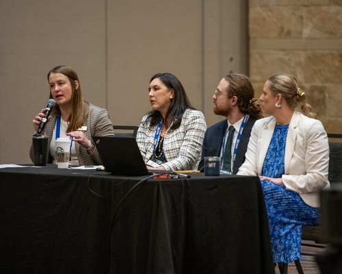 A group of four panelists at the Transportation Symposium. 
