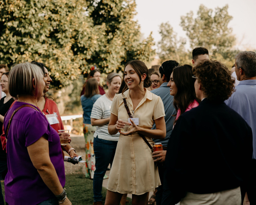 A group of five people chatting. Photos by Brooke Silverman