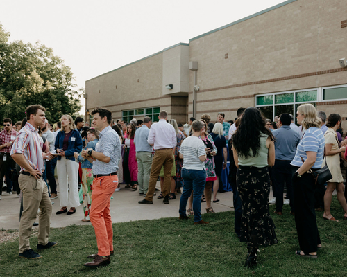 View of a large group of people conversing. Photos by Brooke Silverman