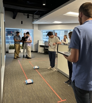 JMT’s Technology Group runs demonstration on using coding & iPads to drive robot cars