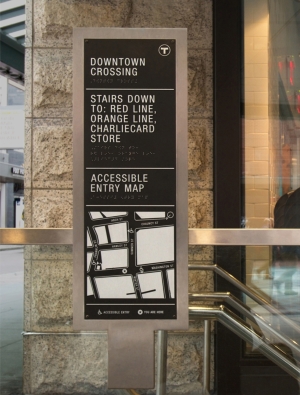 Wayfinding sign at Downtown Crossing with white lettering as well as braille