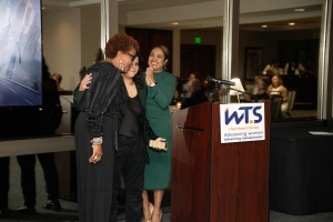 woman walking to podium