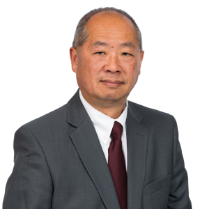 Headshot of man in gray suit with maroon tie